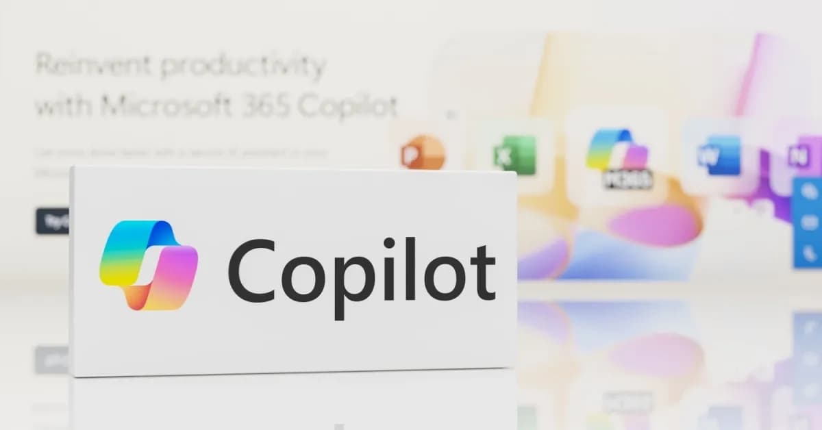 Microsoft Copilot logo displayed on a screen with blurred Microsoft 365 interface behind